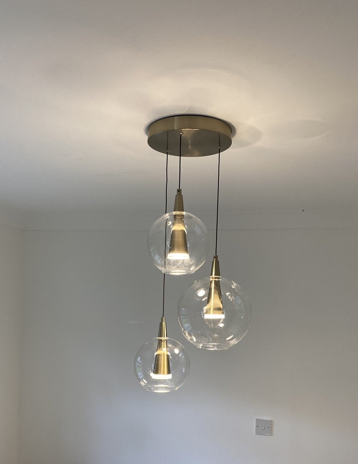 Pendant light installation with three glass pendant lights in Suffolk