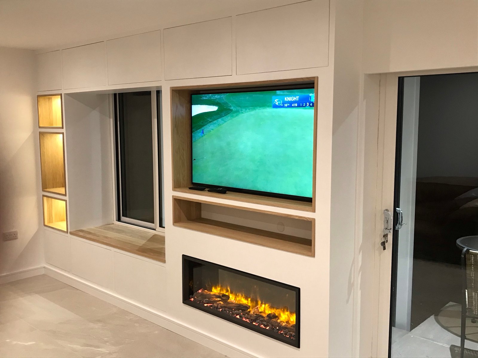 Bespoke media unit with integrated lighting and electric fireplace in Ipswich